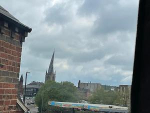 a view of a city with a church steeple at The Old Dance School - 1 and 2 Bedroom Apartments in the Heart of Chesterfield in Chesterfield