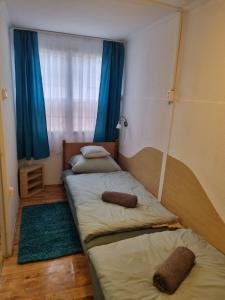 Postel nebo postele na pokoji v ubytování Nébel Vendégház + 18 fotografií