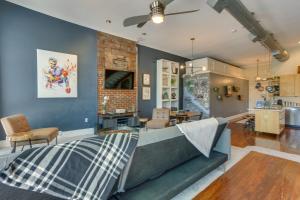a bedroom with a couch and a living room at Kentucky Bourbon Loft about Downtown Louisville in Louisville