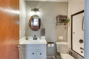 a bathroom with a sink and a toilet and a mirror at Kentucky Bourbon Loft about Downtown Louisville in Louisville +24 photos