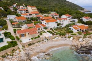 an aerial view of a village with a beach at Didova kuća (Grandpa’s house) in Vis