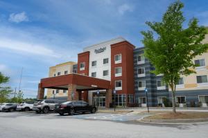 a rendering of a hotel with cars parked in a parking lot at Fairfield Inn & Suites by Marriott Atlanta Fairburn in Fairburn