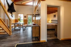 a bedroom with a bed and a desk in a room at Red Cariboo Resort in Anahim Lake