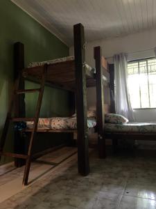 a room with two bunk beds and a window at Nomada Hostel in Leticia