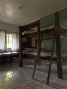 a room with two bunk beds and a window at Nomada Hostel in Leticia
