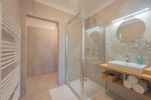 a bathroom with a shower and a sink and a mirror at Vlaštovčí dům in Nové Město nad Metují +67 photos