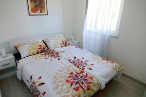 Postel nebo postele na pokoji v ubytování Apartments 1234