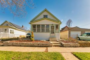 a small white house with a driveway at Modern, Charming Bungalow by the Park in Saint Paul