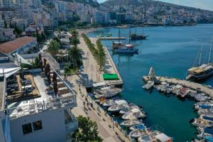 an aerial view of a marina with boats in the water at Porto Eda Hotel in Sarandë