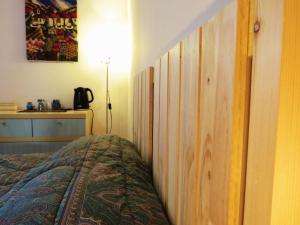 Postel nebo postele na pokoji v ubytování B&B CasaGiò