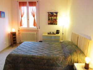 Postel nebo postele na pokoji v ubytování B&B CasaGiò