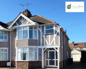 a detached house with large windows and doors at 3 Bedroom 2 Bath House By Passionfruitproperties Near Coventry City Centre - Free Wi-fi, Pool Table And Garden - MAC in Coventry