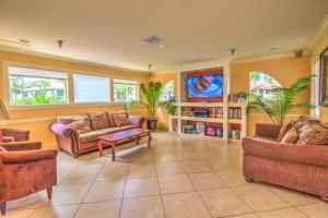 a living room with two couches and a table at Stunning & Serene. Minutes to Anna Maria Island+++ in Bradenton