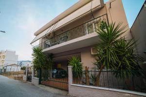 a building with plants on the side of it at Sandscape Serenity S2 in Volos