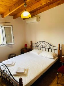 Ένα ή περισσότερα κρεβάτια σε δωμάτιο στο Villa Elena