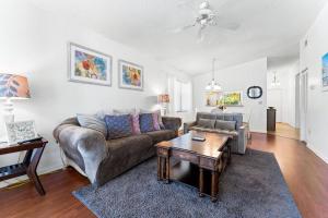 a living room with a couch and a table at Minutes to Anna Maria Island in Bradenton