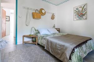 Voodi või voodid majutusasutuse Ocean Vibes Montalivet B&B toas