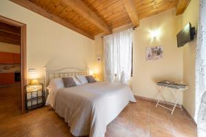 Postel nebo postele na pokoji v ubytování La Suite del Borgo