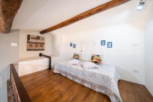 Postel nebo postele na pokoji v ubytování La Suite del Borgo