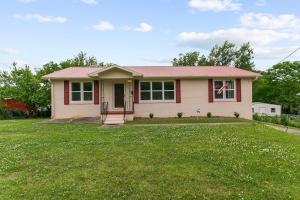a small house with a green lawn in front of it at 10 Min to Downtown-Modern in Magic City-Both Units in Birmingham