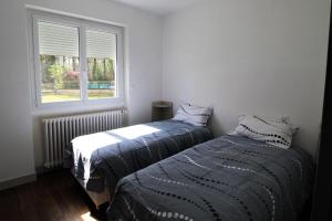 Кровать или кровати в номере Bois de l'age