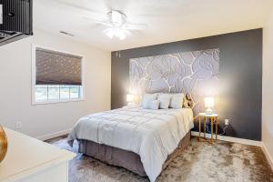 a bedroom with a large bed with a accent wall at River Oaks 40D in Myrtle Beach