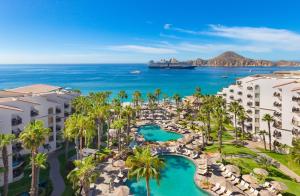 an aerial view of a resort with palm trees and the ocean at Villa del Palmar Beach Resort & Spa in Cabo San Lucas