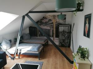 a room with two beds in a attic at Meisterhaus Apartment 8 in Glauchau