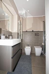 a bathroom with a sink and a toilet at Il mare dietro l'angolo in Varazze