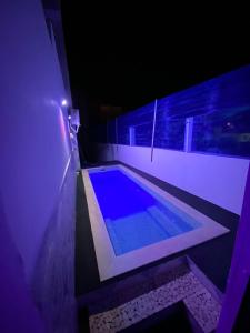 a swimming pool in a house at night at Dar el oued in Tangier