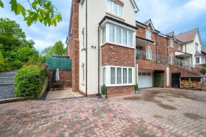 an empty driveway in front of a brick house at Personal En-suite in Shrewsbury