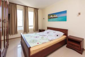 A bed or beds in a room at Apartment Patriarh Evtimiy