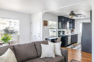 a living room with a couch and a kitchen at Immaculate Charming Duplex-1Unit in Oroville