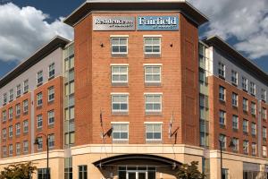 a brick building with a sign on top of it at Fairfield Inn & Suites by Marriott Boston Logan Airport/Chelsea in Chelsea