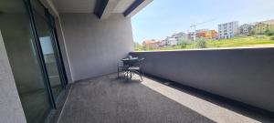 a chair sitting on the balcony of a building at YAMADA in Năvodari