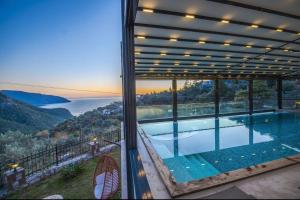 a view of a swimming pool from a house at Kalabantia House in Fethiye