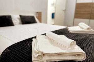 A bed or beds in a room at Citadella Apartment
