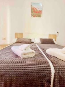 A bed or beds in a room at Citadella Apartment