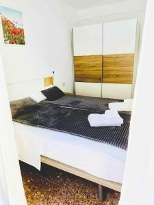 A bed or beds in a room at Citadella Apartment