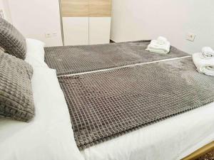 A bed or beds in a room at Citadella Apartment