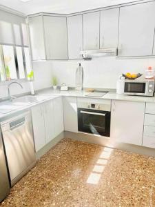 A kitchen or kitchenette at Citadella Apartment