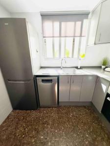 A kitchen or kitchenette at Citadella Apartment