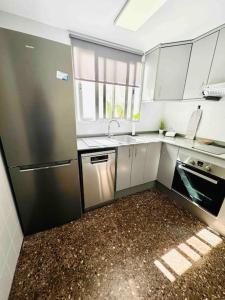 A kitchen or kitchenette at Citadella Apartment