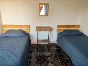 Voodi või voodid majutusasutuse Pirca Hostal toas