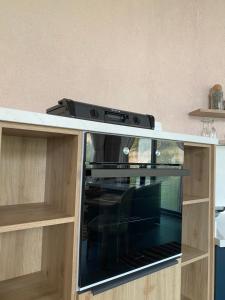 a stove in a cabinet in a kitchen at Hestia View in Fethiye