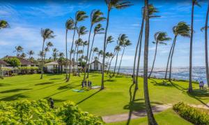 a park with palm trees and the ocean at Kiahuna Plantation Unit 42, Air Conditioning, 2 Minute Walk to Beach in Koloa