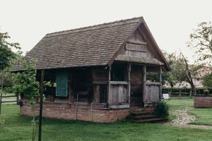 an old building in a field of grass at HOLY in Ðakovo