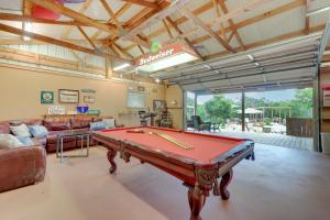 a living room with a pool table in it at New Braunfels Home with Pool 2 Mi to Guadalupe River in New Braunfels