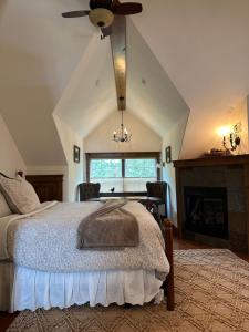 a bedroom with a bed and a ceiling fan at Wood's Lodge in Whitefish