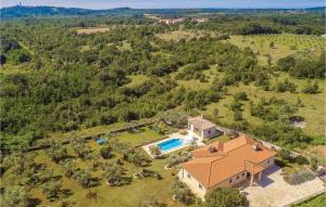 an aerial view of a house with a swimming pool at 4 Bedroom Nice Home In Buje in Buje
